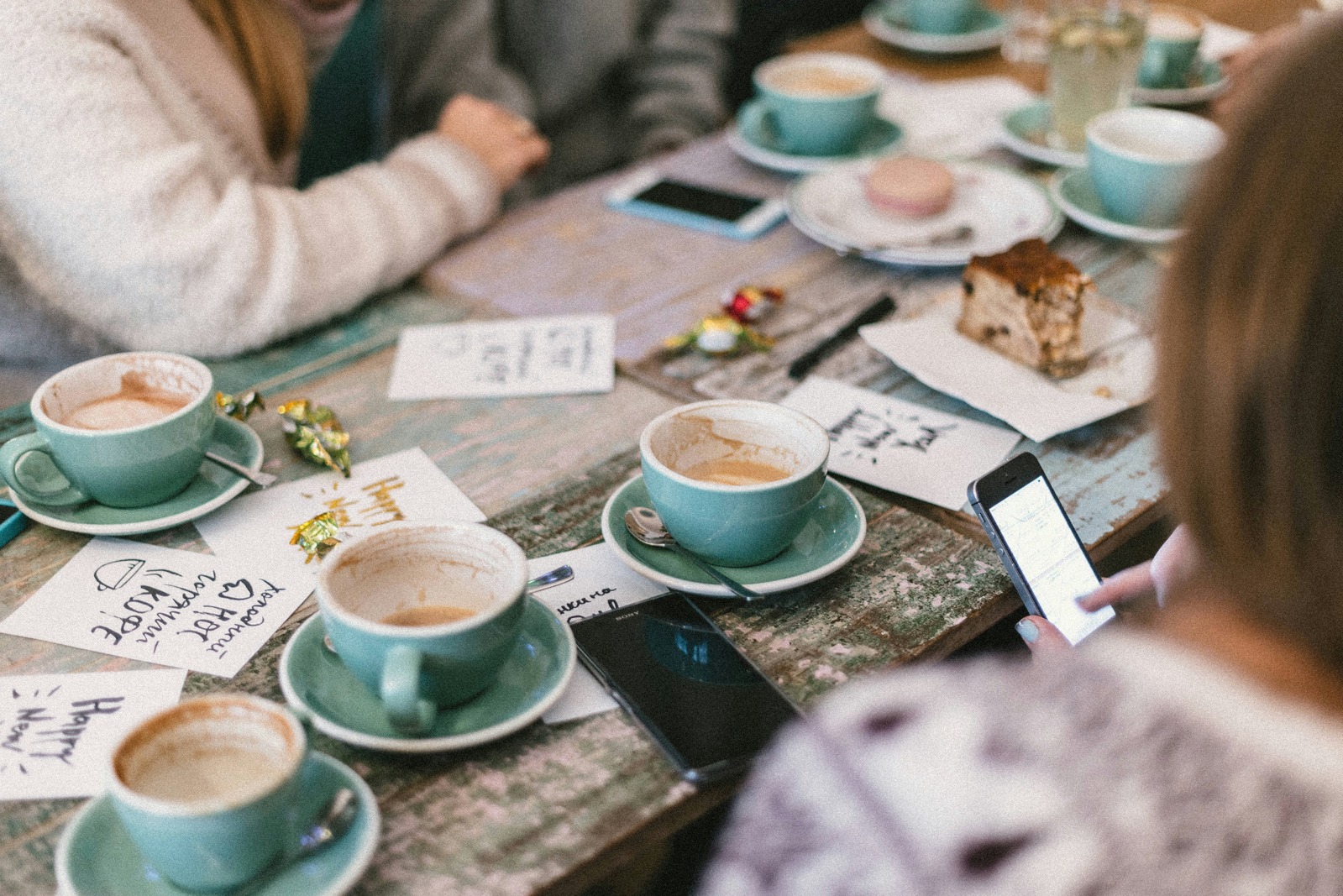 A warm CSN gathering around a table over coffee